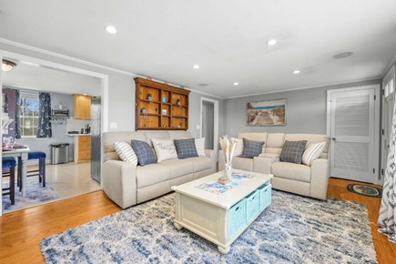 South Yarmouth Cape Cod vacation rental - A living room that seamlessly flows into the dining area
