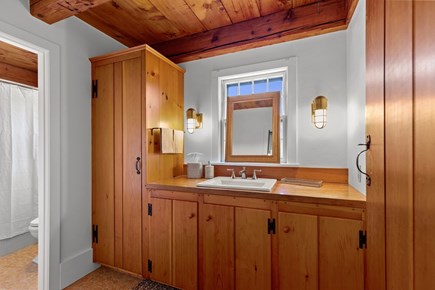 Eastham, Bridge Meadow Cape Cod vacation rental - Full bath with warm wood vanity and shower tub combo