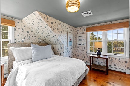 Eastham, Bridge Meadow Cape Cod vacation rental - Charming queen bedroom with whimsical wallpaper and natural light