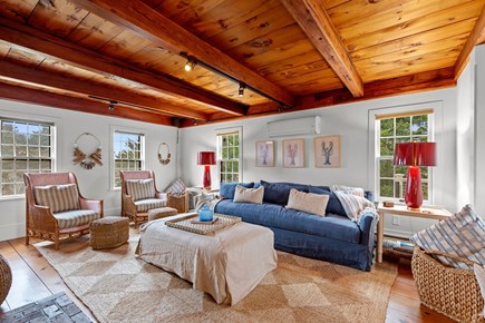 Eastham, Bridge Meadow Cape Cod vacation rental - Sunny living room with exposed beams and coastal seating