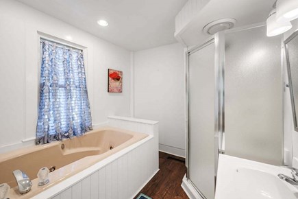South Yarmouth Cape Cod vacation rental - Main level primary #1 ensuite full bath with jetted tub.