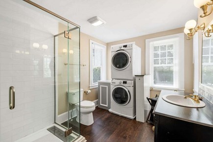 South Yarmouth Cape Cod vacation rental - En-suite full bathroom in primary bedroom #2 also features laundry facilities.