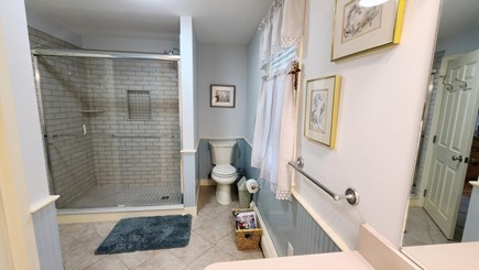 Wellfleet Cape Cod vacation rental - First floor bathroom with custom tile shower and laundry