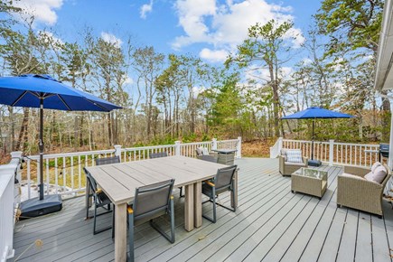 Harwich Cape Cod vacation rental - Deck with outdoor dining and seating area