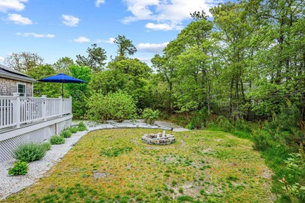 Harwich Cape Cod vacation rental - Fire pit in backyard