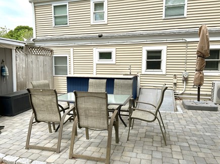 West Yarmouth Cape Cod vacation rental - Enjoy tables and chairs for al fresco dining, bar, and shower