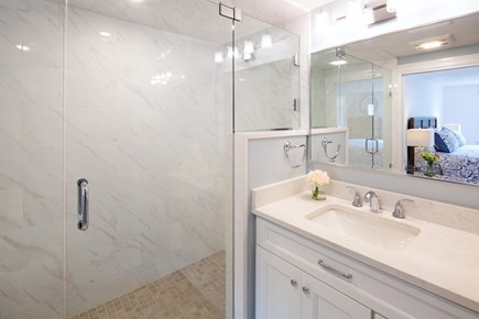 Chatham Cape Cod vacation rental - The primary bath has a sizeable tile and glass shower along with a custom vanity