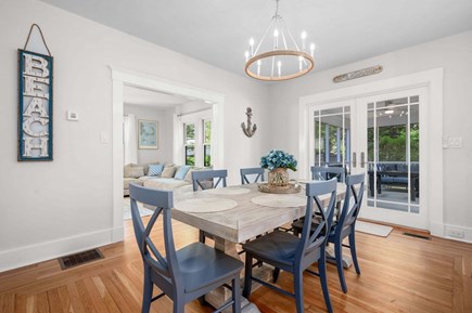 South Yarmouth Cape Cod vacation rental - Dining room with seating for six at the table and another four seats at the nearby breakfast bar