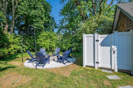 South Yarmouth Cape Cod vacation rental - Fire pit area and nearby outdoor shower