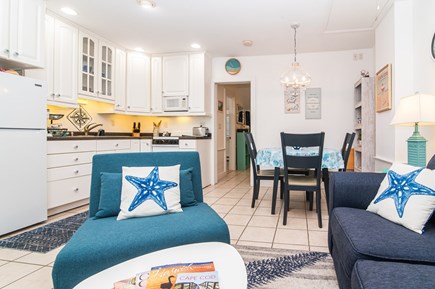 Harwichport Cape Cod vacation rental - Living room, kitchen, dining area.