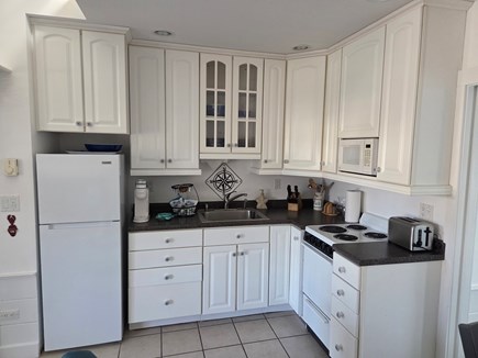 Harwichport Cape Cod vacation rental - Kitchen w/ fridge, stove w/ oven, toaster, Keurig & microwave