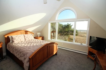 Wellfleet Cape Cod vacation rental - Second floor primary suite with queen bed and tidal marsh view