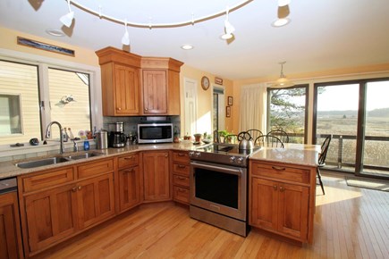 Wellfleet Cape Cod vacation rental - Nicely equipped eat-in kitchen with slider to upper deck