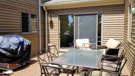 Wellfleet Cape Cod vacation rental - Dining table and gas grill on upper deck