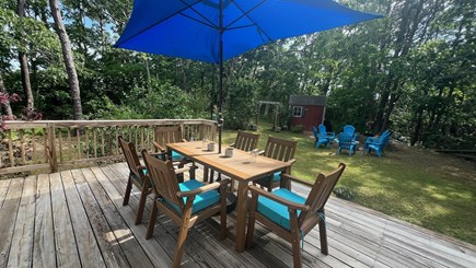 Eastham Cape Cod vacation rental - Large back deck with seating for 6 plus firepit
