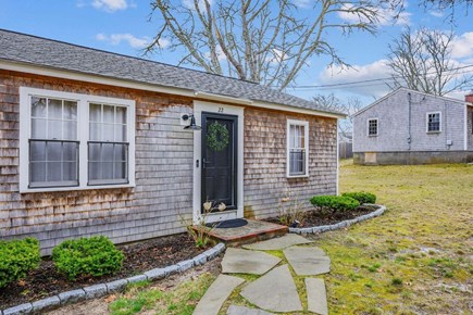 Dennis Port Cape Cod vacation rental - Cozy, welcoming Cape Cod style cottage with a stone walkway and beautiful greenery