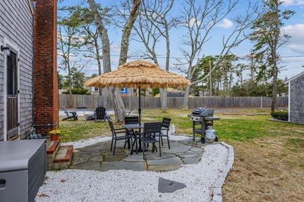 Dennis Port Cape Cod vacation rental - Patio with dining table and grill