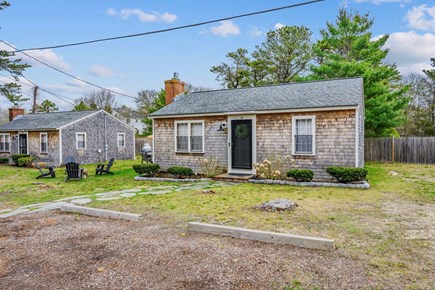 Dennis Port Cape Cod vacation rental - Cozy, welcoming Cape Cod style cottage with a stone walkway and beautiful greenery