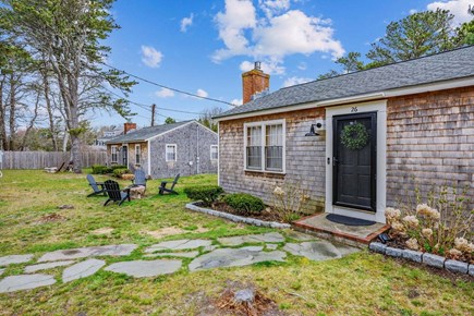 Dennis Port Cape Cod vacation rental - Cozy, welcoming Cape Cod style cottage with a stone walkway and beautiful greenery