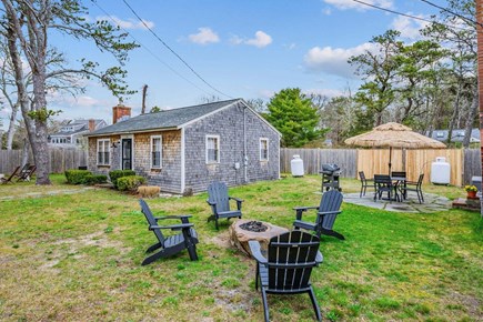 Dennis Port Cape Cod vacation rental - Adirondack chairs with a fire pit perfect for a family gathering