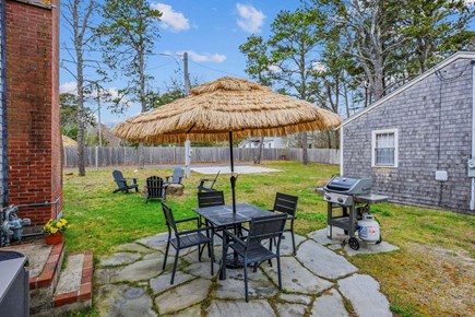 Dennis Port Cape Cod vacation rental - Patio with dining table and grill