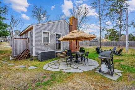 Dennis Port Cape Cod vacation rental - Patio with dining table and grill
