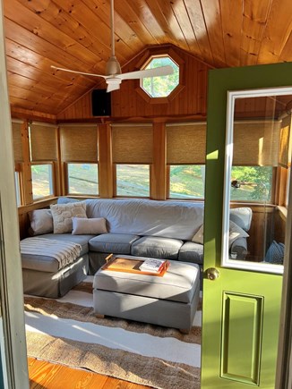 Wellfleet Cape Cod vacation rental - Sunroom with cozy sectional, smart TV and pullout bed