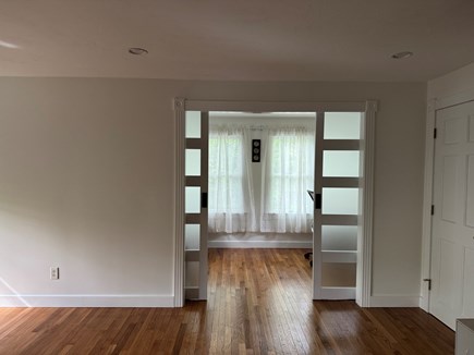 West Yarmouth Cape Cod vacation rental - Barn door to the office, with pull-out couch