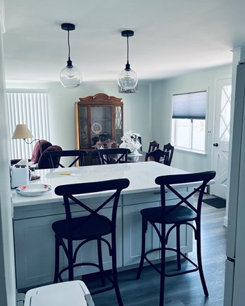 Popponessett Cape Cod vacation rental - Kitchen (new) and dining area into living room