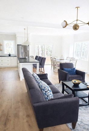 South Yarmouth Cape Cod vacation rental - Open concept living room, kitchen, dining with slider to backyard