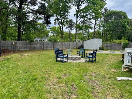 Eastham Cape Cod vacation rental - Fully-fenced backyard with fire pit, garden & lawn games