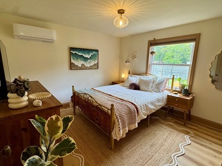 Eastham Cape Cod vacation rental - Shell & shore-inspired bedroom with smart TV and en-suite bath