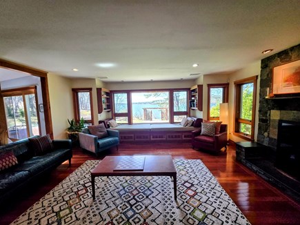 Brewster, Upper Mill Pond Cape Cod vacation rental - Living area with fireplace, waterviews, TV, daybed, games