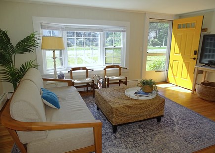 Eastham Cape Cod vacation rental - Sunny living room with bay window and TV