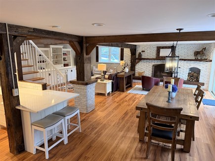Eastham, Salt Pond Seashore Cape Cod vacation rental - Dining, breakfast seating, and living room gather brightly.