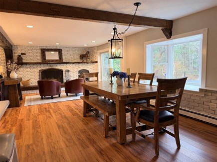 Eastham, Salt Pond Seashore Cape Cod vacation rental - Dining area by fireplace for shared dinners after beach.