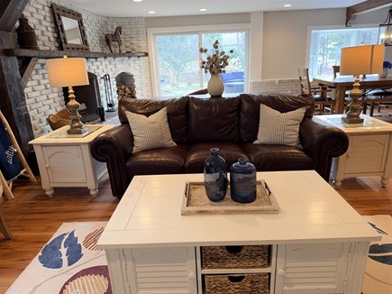 Eastham, Salt Pond Seashore Cape Cod vacation rental - Comfortable seating anchors living room by fireplace.