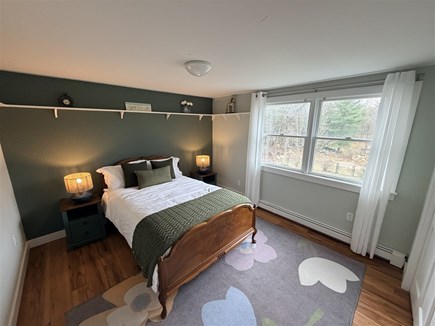 Eastham, Salt Pond Seashore Cape Cod vacation rental - Inviting upstairs bedroom with rich accents, warm wood.