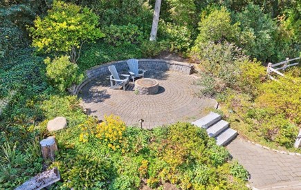 East Orleans  Cape Cod vacation rental - Fire pit patio surrounded by lush plantings
