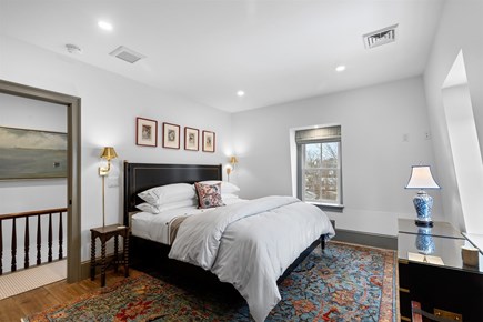 Provincetown, The Tucker House Cape Cod vacation rental - Upstairs bedroom with colorful rug and classic style