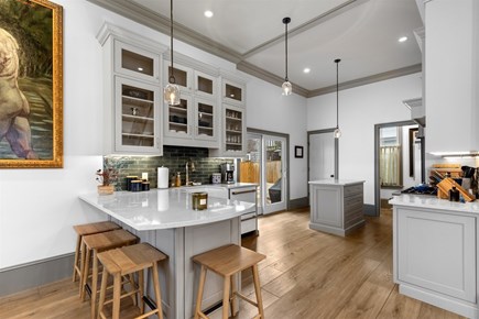 Provincetown, The Tucker House Cape Cod vacation rental - Light-filled kitchen, large island, outdoor access.