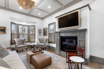 Provincetown, The Tucker House Cape Cod vacation rental - Main living room with seating, fireplace, beachside charm.