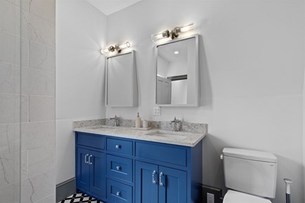 Provincetown, The Tucker House Cape Cod vacation rental - Stylish full bathroom with bold blue double vanity