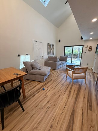 Falmouth Cape Cod vacation rental - Living room opening to private deck and fenced in large yard