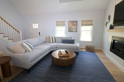 Brewster Cape Cod vacation rental - One view of living room open to kitchen & dining