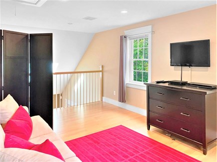 East Harwich Cape Cod vacation rental - View of the loft area with a Queen sleeper sofa and flat screen TV
