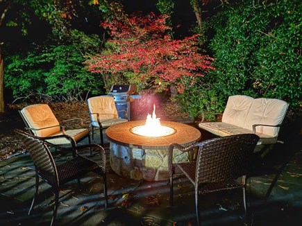 Harwich Port Cape Cod vacation rental - Gas fire pit, dusk, the Cape going quiet — repeat nightly.