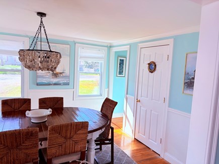 Hyannis Cape Cod vacation rental - Kitchen looking into dining room w/ porthole & oyster chandelier