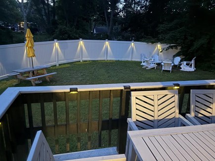 Hyannis Cape Cod vacation rental - Backyard lit at night