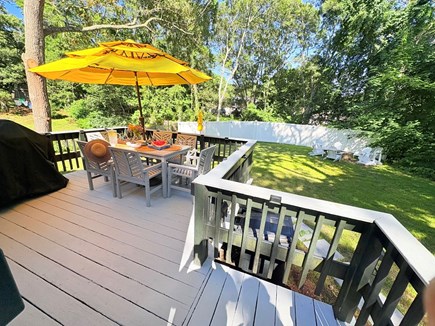 Hyannis Cape Cod vacation rental - Private yard overlooking picnic table, firepit and outdoor shower